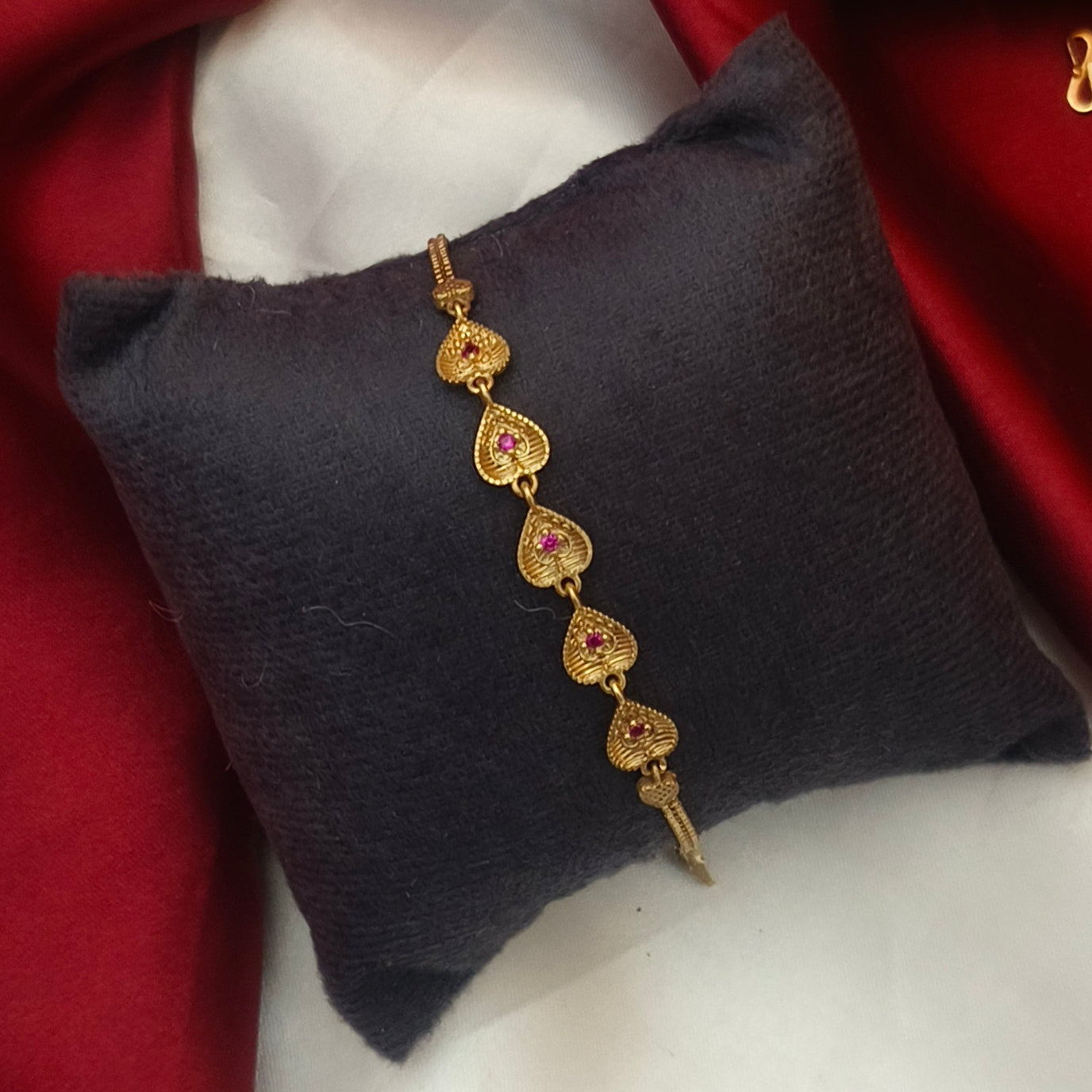 Pure impon heart pattern ruby toned bracelet BR- 51020